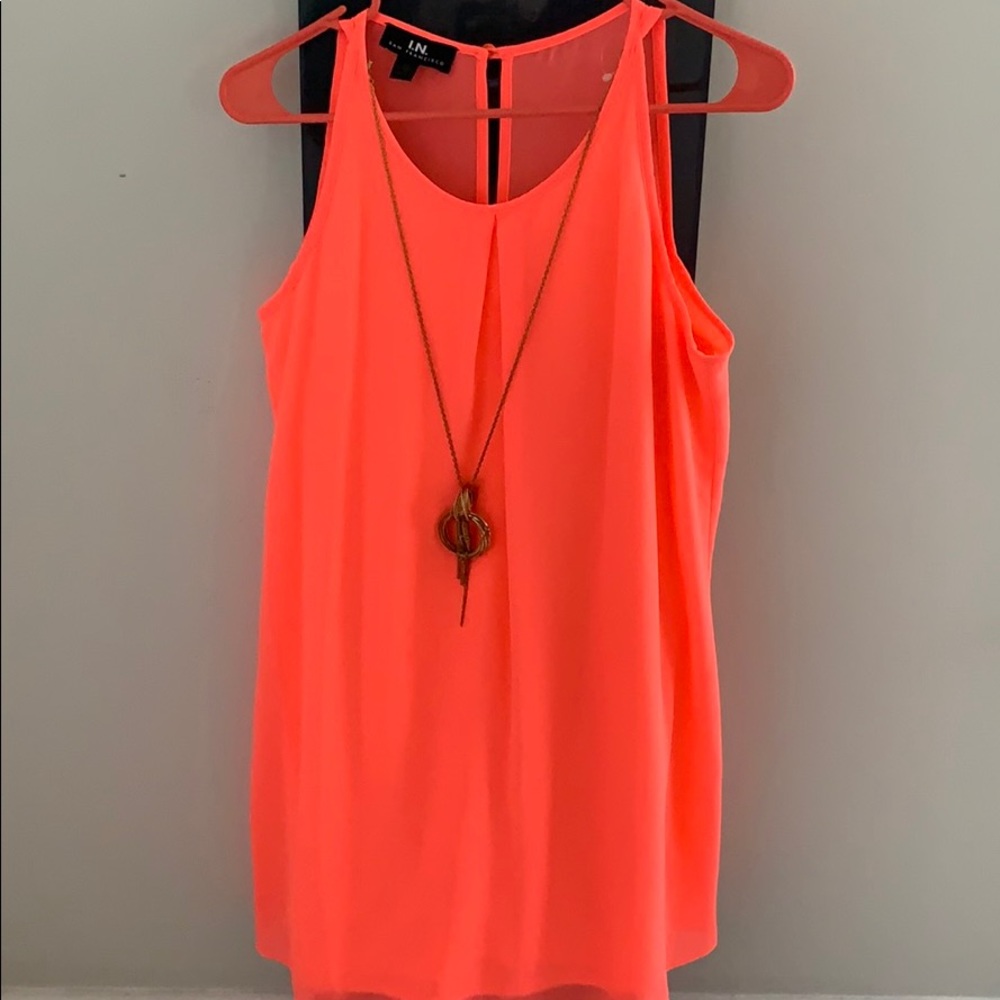 Pink tank sleeve dress.